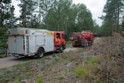 3 Fire Vehicles At A Forest Fire